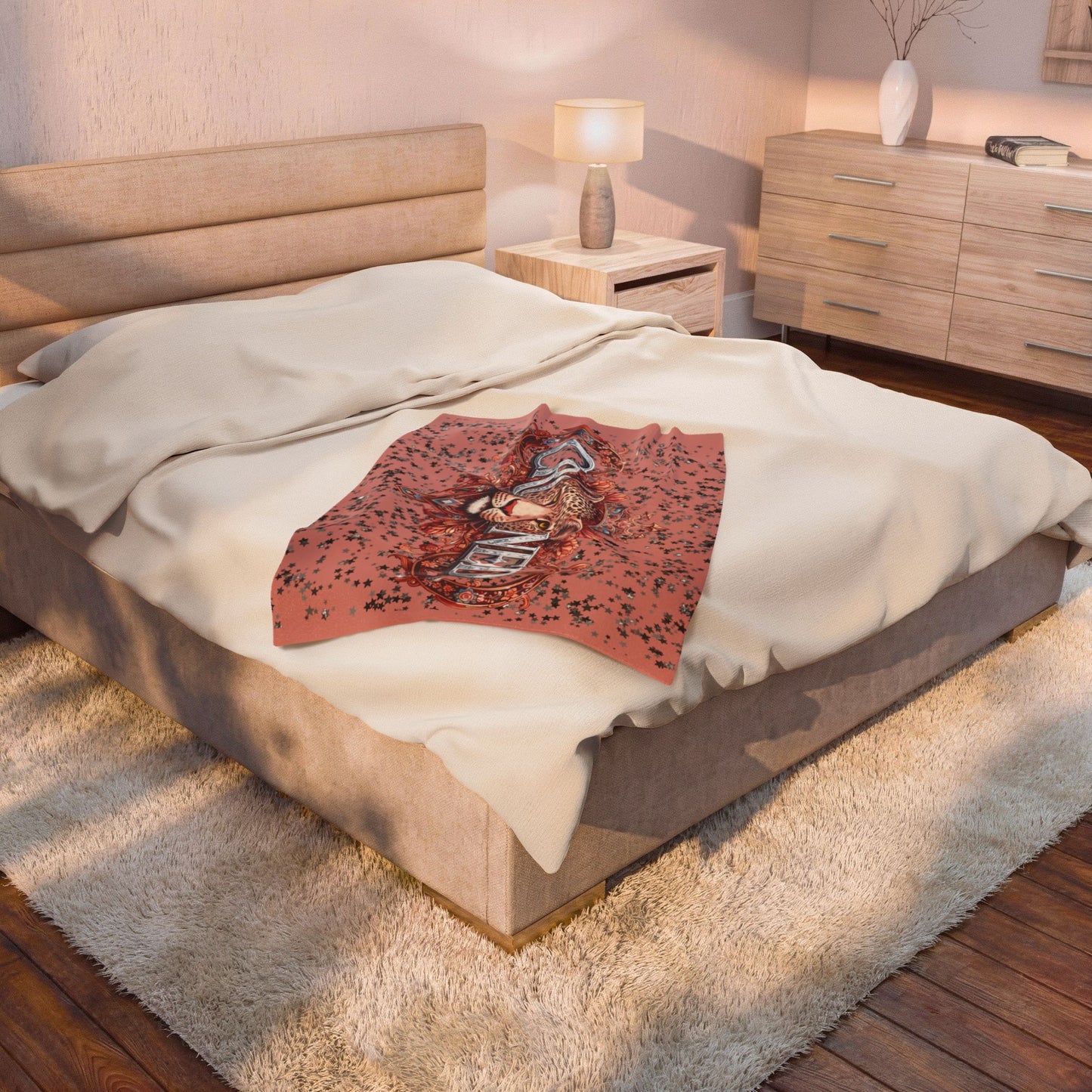 Decorative blanket with a leopard design on a bed in a bedroom setting