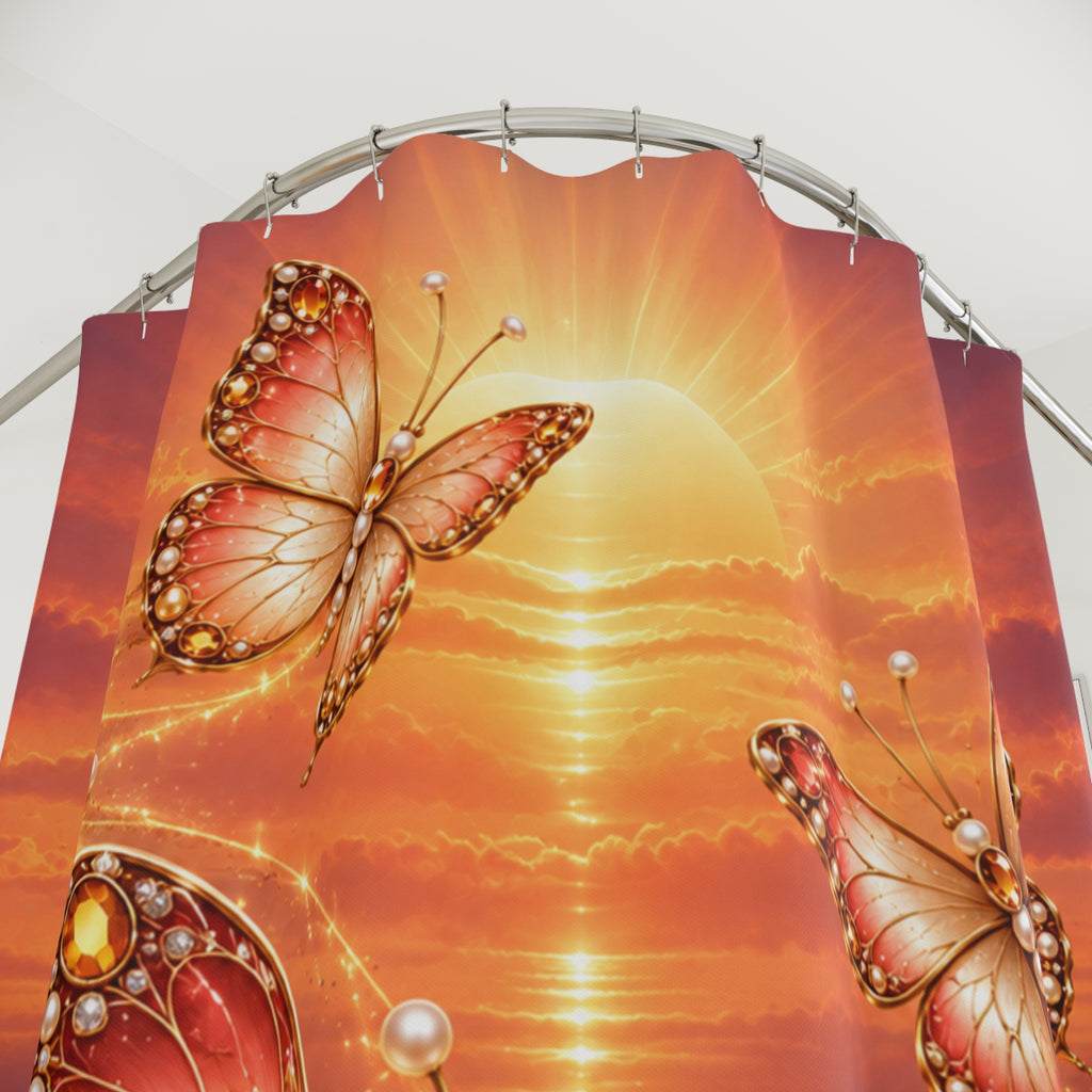 A large printed fabric shower curtain featuring a glowing orange sunset with two ornate butterflies and pearl-like accents, hanging from a curved metal rod against a plain light background.
