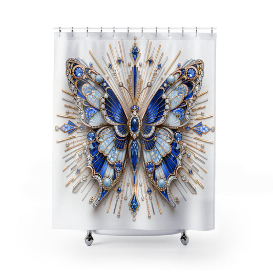 A white shower curtain featuring a large ornate butterfly design in shades of blue, silver, and gold, hanging from silver hooks against a plain white background.