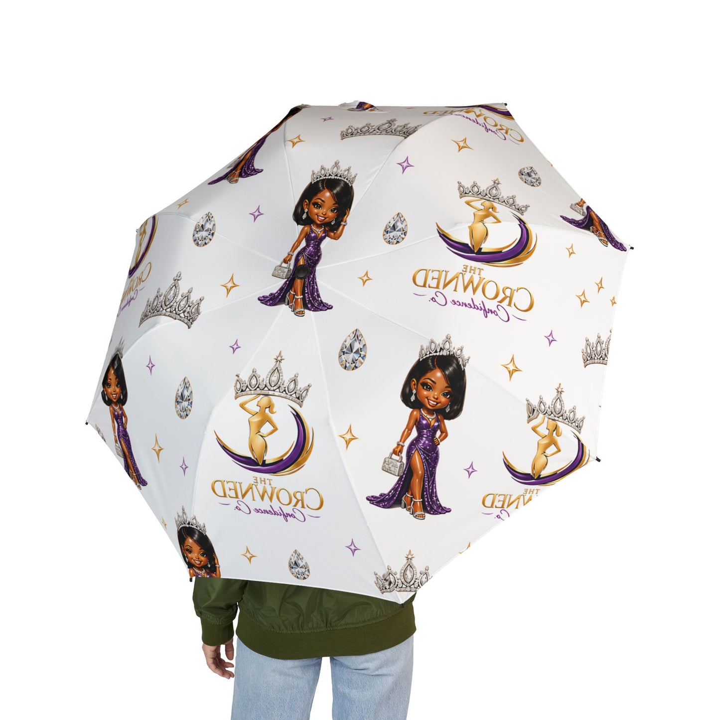 Umbrella with cartoon character and 'Crowned' logo on a white background