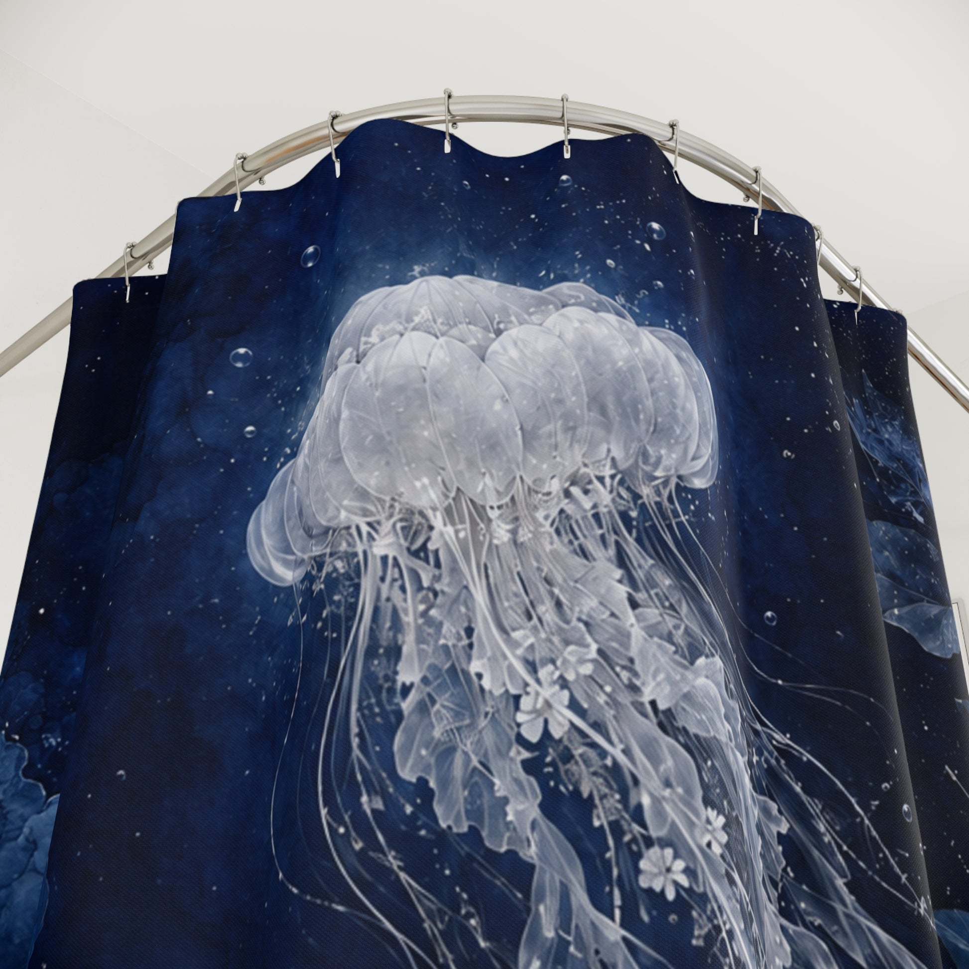 A shower curtain featuring a large white jellyfish design over a dark navy blue background with subtle star-like speckles, hanging from a curved metal rod.