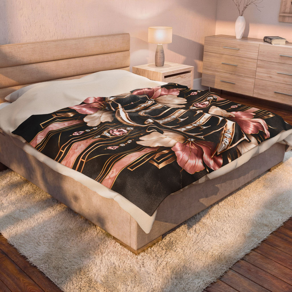 A bed in a styled bedroom setting, featuring a black duvet cover with a detailed pink and gold Japanese-style floral and wave pattern, styled with white pillows.