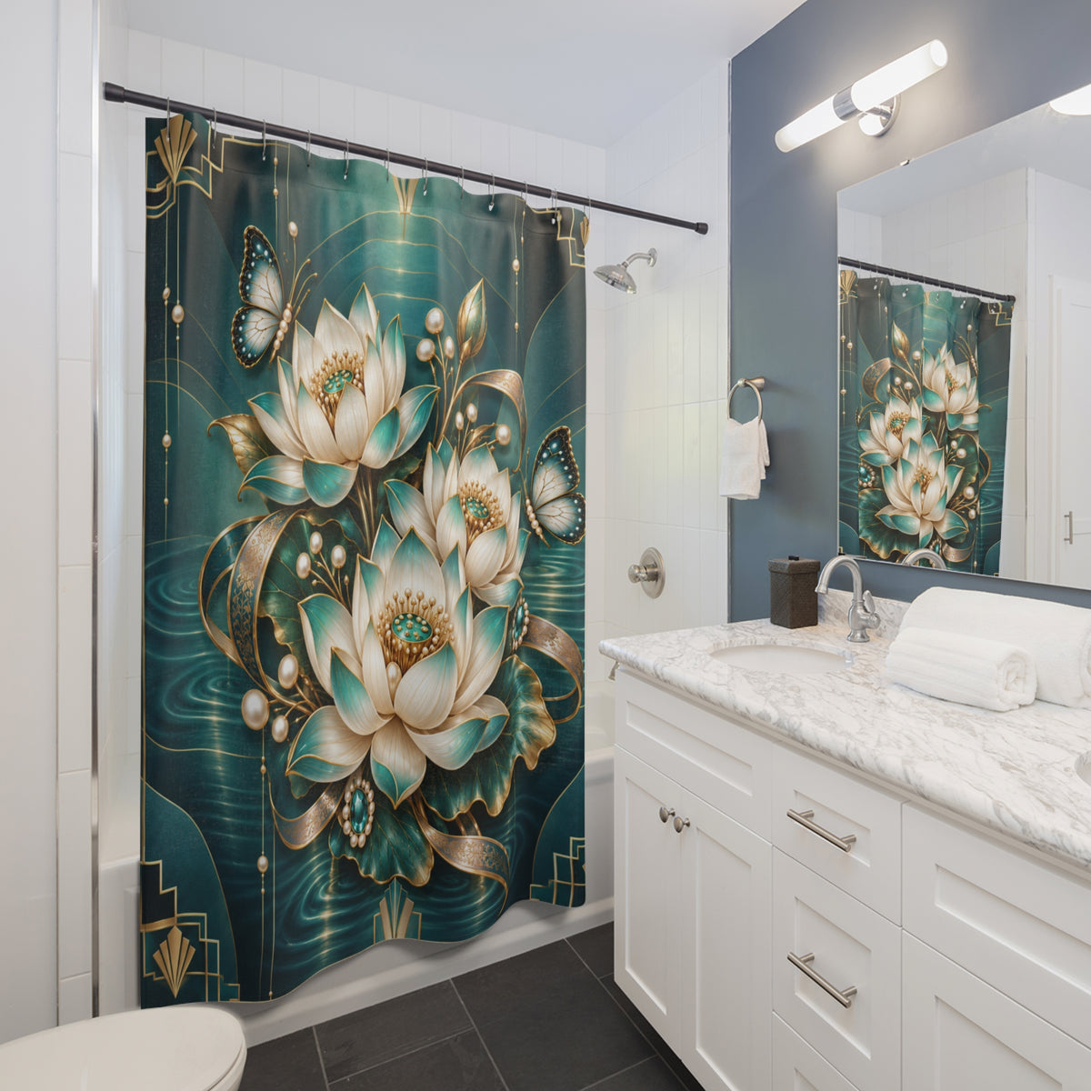 A teal and gold shower curtain with large lotus flowers and butterflies hanging in a modern bathroom with white cabinets, a marble countertop, and a mirror reflecting the design.