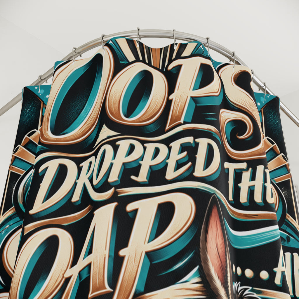 A close-up of a large decorative shower curtain with stylized 3D lettering that reads 'Oops Dropped The Soap.er c