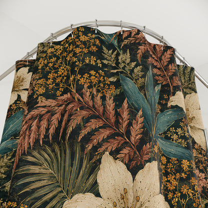 A tropical botanical print fabric curtain hanging from a silver metal rod against a plain white wall. The pattern features large cream-colored lilies, teal and rust-brown ferns, and yellow flowers on a dark background.