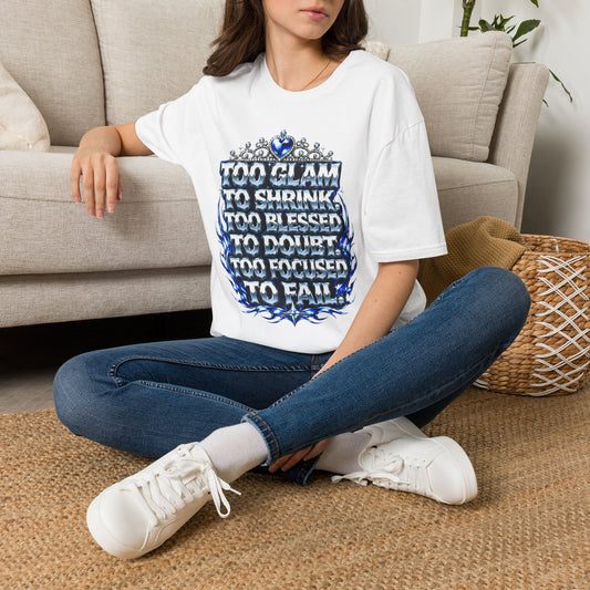 Person wearing a white t-shirt with a chess-themed design sitting on the floor.