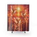 A shower curtain featuring a vibrant, glowing digital illustration of three hummingbirds in flight over rippling water under a bright sunburst. The design is dominated by warm red, orange, and gold tones, with small white pearl-like accents.