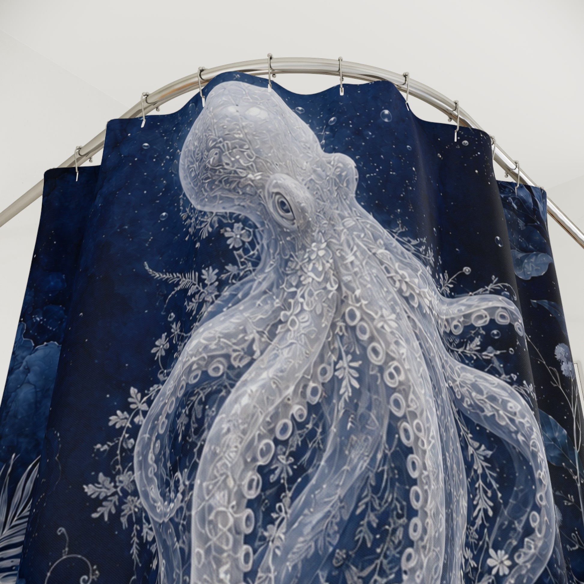 A dark navy blue shower curtain featuring a large white octopus illustration with detailed tentacles and floral sea-plant motifs, hanging from a curved metal rod against a plain light background.