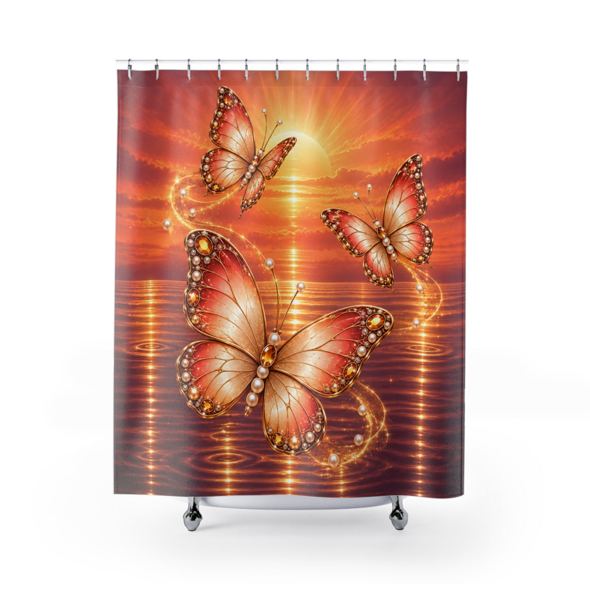 A shower curtain featuring a vibrant sunset and sunrise design over water with three large, detailed orange and gold butterflies, shown hanging from silver rings on a white background.