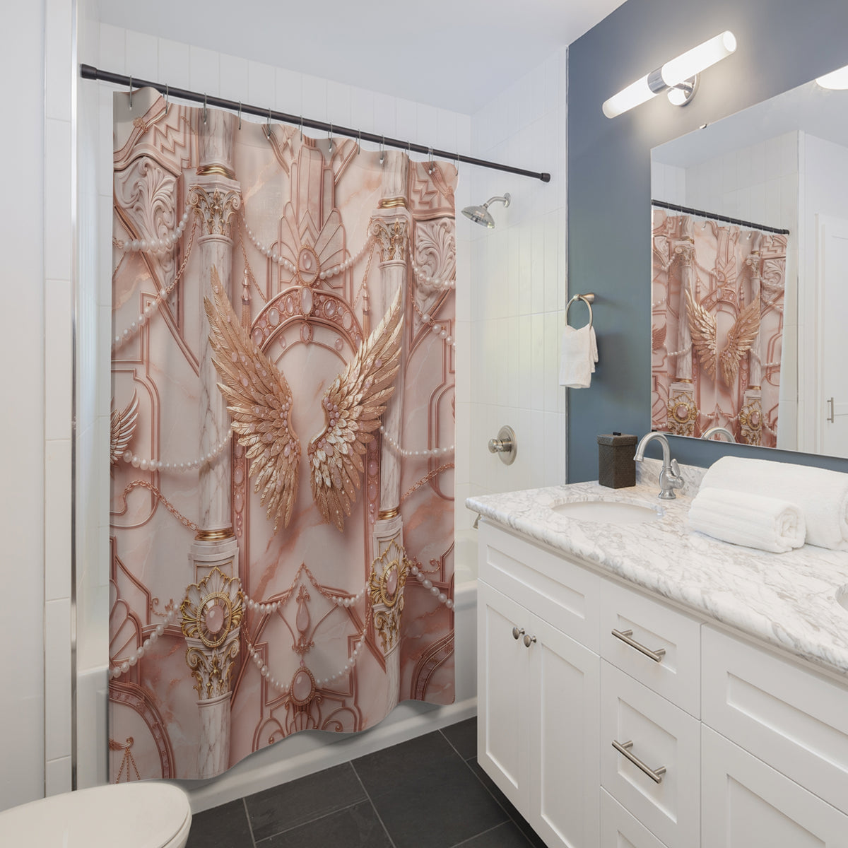 A shower curtain with a detailed rose gold and gold architectural pattern featuring a large angel wing in the center, hanging in a modern bathroom next to a white marble vanity.