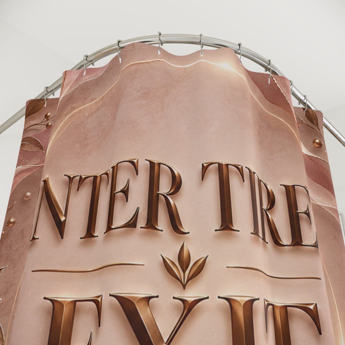 A close-up of a large decorative shower curtain with raised metallic lettering reading 'INTER TRE.
