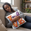 Woman holding a pillow with 'LOVE' and butterfly design in a living room.