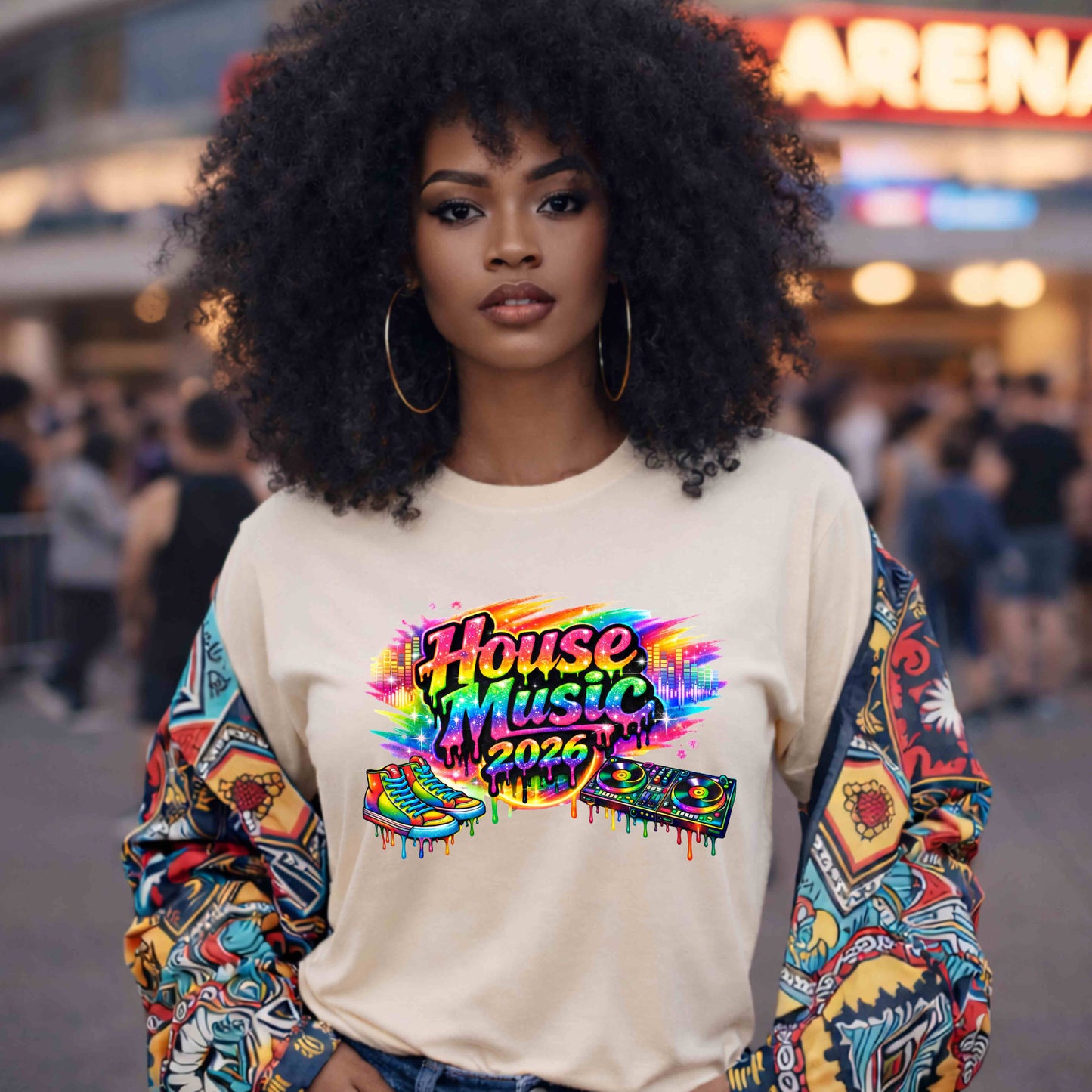 Woman wearing a colorful 'House Music 2026' sweatshirt in an arena setting