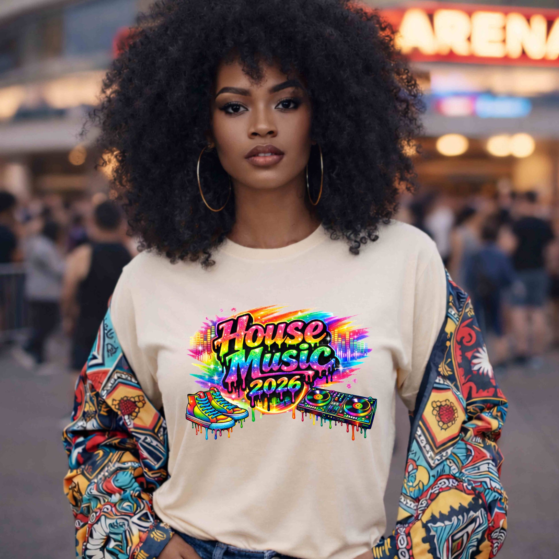 Woman wearing a colorful 'House Music 2026' sweatshirt in an arena setting