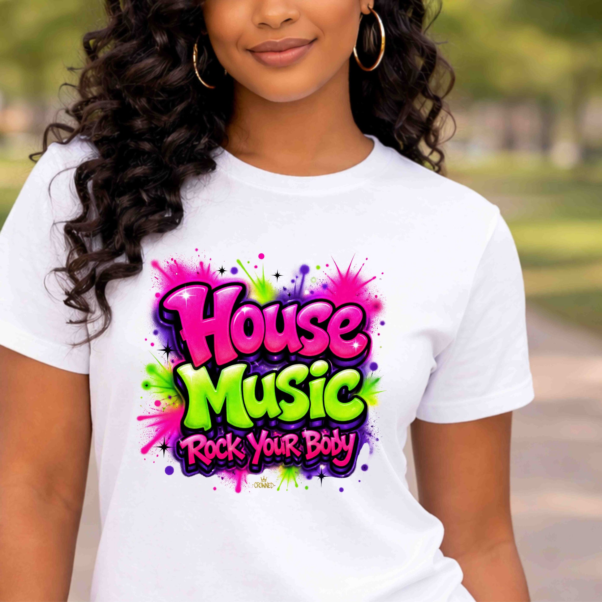 Person wearing a white t-shirt with 'House Music Rock Your Body' design outdoors.