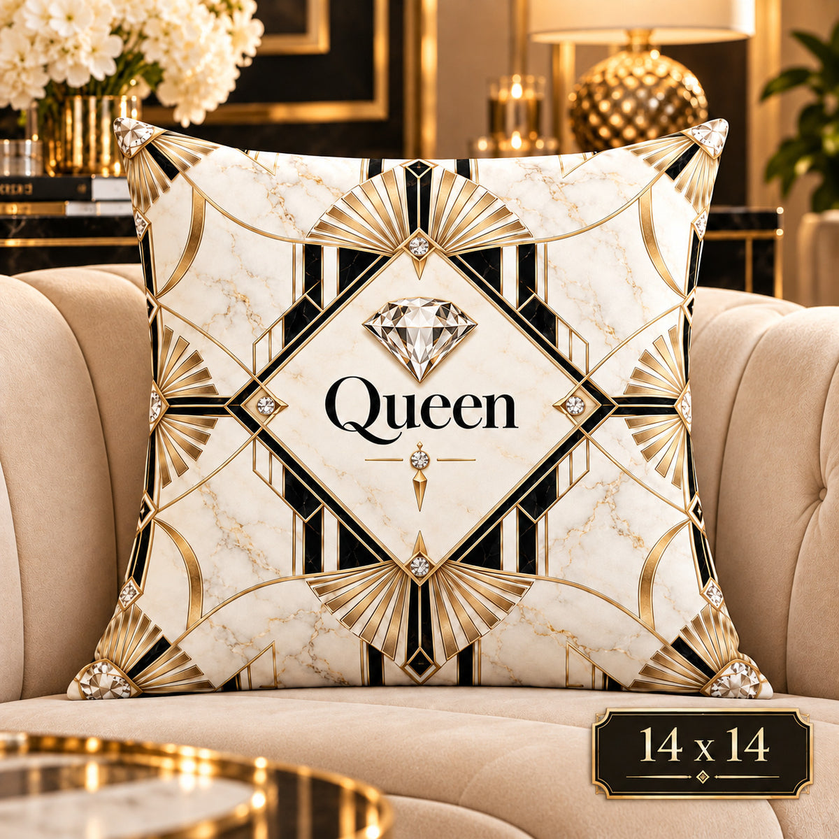 A square decorative throw pillow with an Art Deco style design, featuring a cream marble background, black and gold geometric patterns, and the word 'Queen' in the center. The pillow is styled on a beige armchair in a luxurious, high-end living room setting with gold accents, lamps, and flowers.