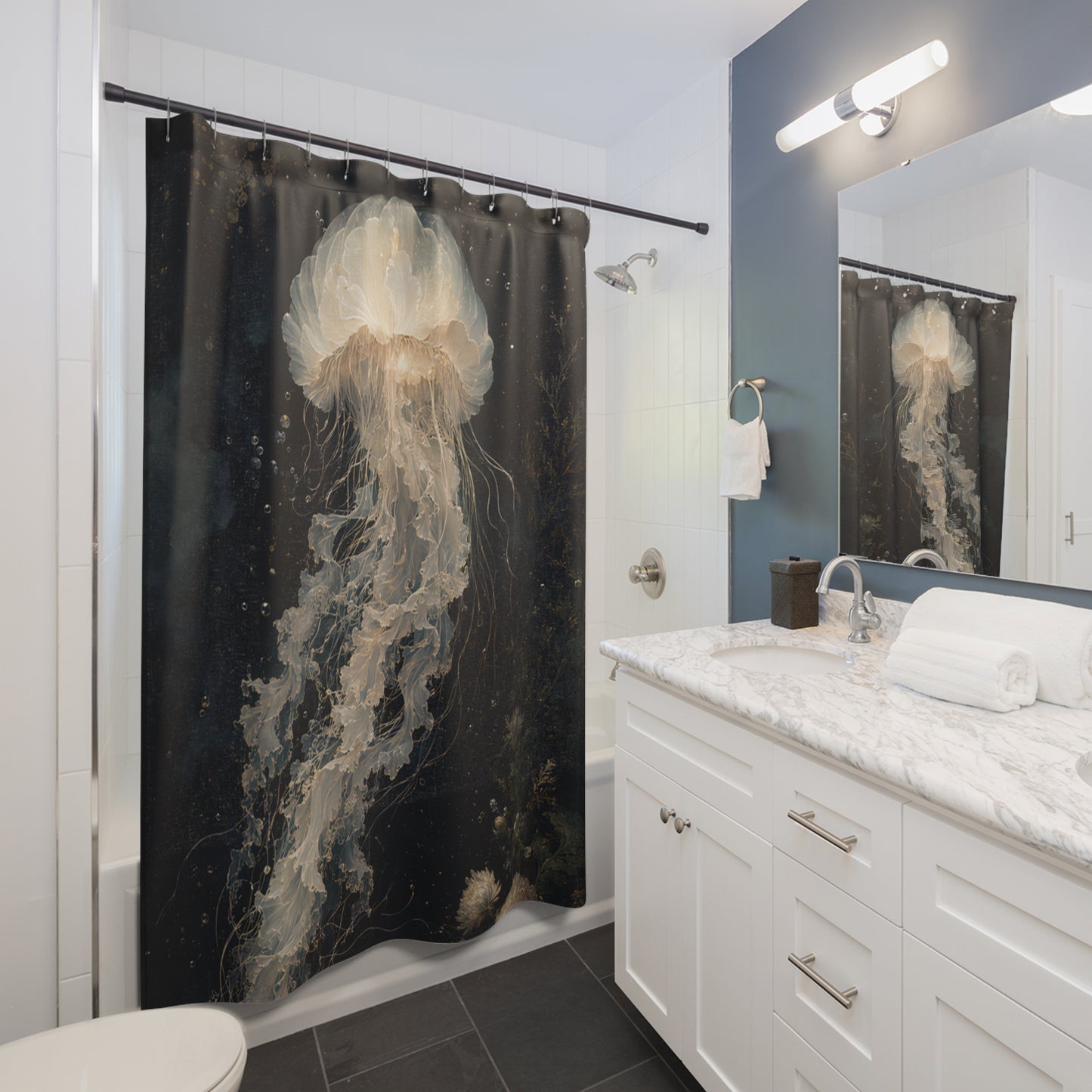 A black shower curtain featuring a large, detailed print of a glowing jellyfish in shades of cream, beige, and white, hanging in a modern white and blue-gray bathroom.