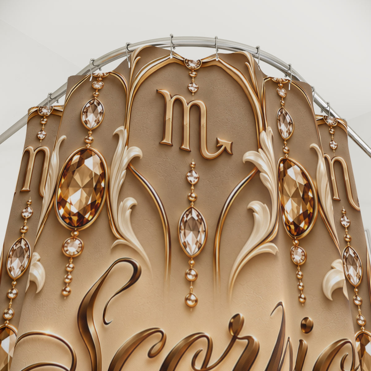 Close-up of an ornate decorative arch or wall panel with a gold-toned astrological symbol resembling Scorpio, embellished with faceted crystal-like drops and sculpted scrollwork on a light neutral background.