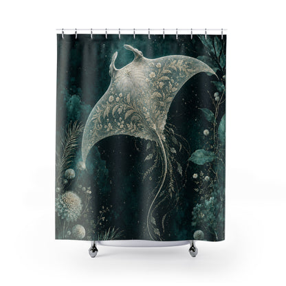 A shower curtain featuring a dark teal and black background with a large pale sage-green manta ray and botanical illustrations, hanging from silver rings on a white rod.