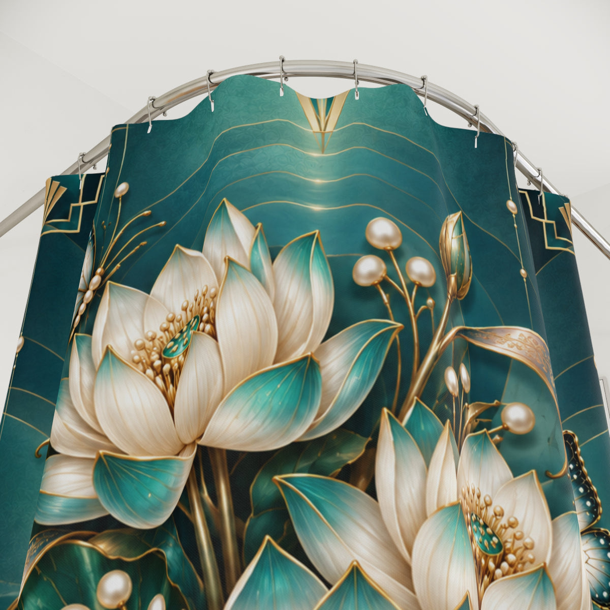A close-up of a decorative curtain panel featuring large lotus flowers in cream and teal with gold detailing, hanging from a curved silver rod against a plain light background.