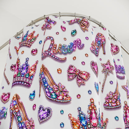 Decorative fabric with 'Queen' text, crowns, high heels, and other embellishments on a white background.