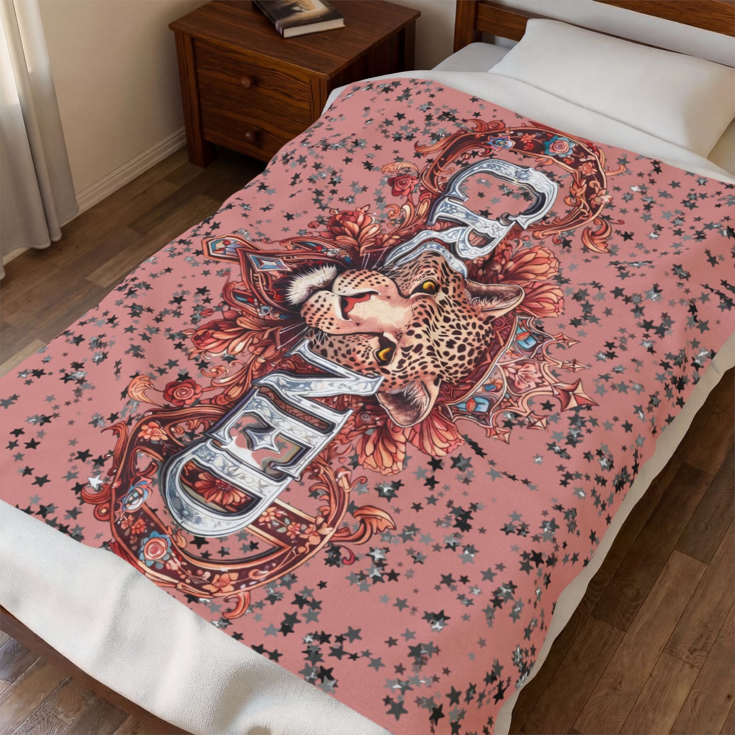 Decorative blanket with a leopard design on a bed in a bedroom setting