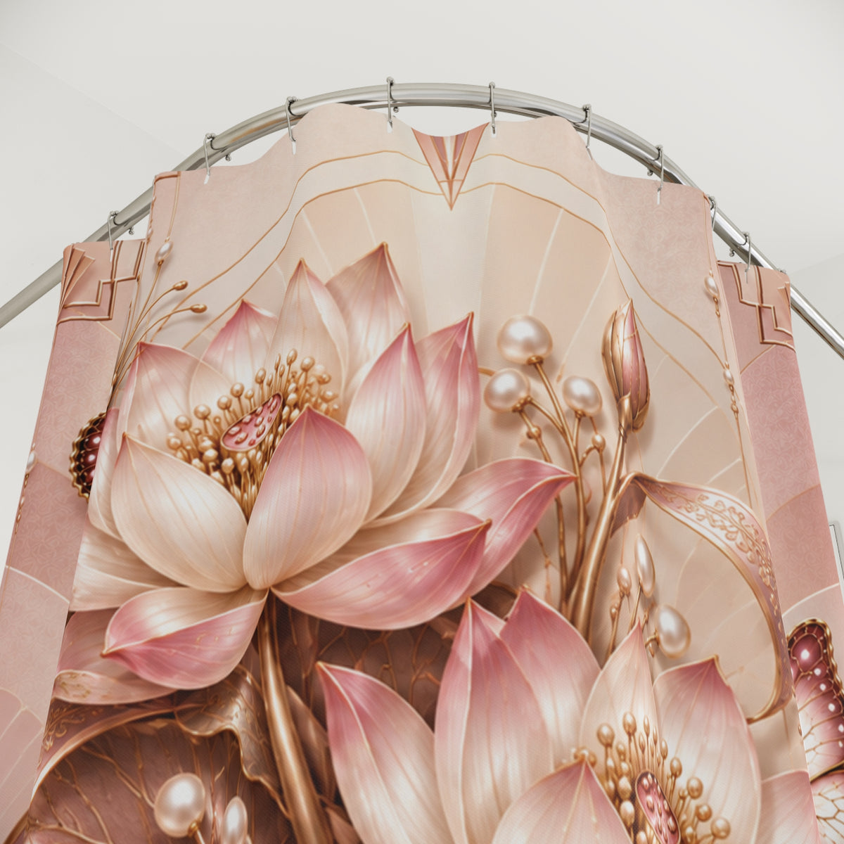 A close-up of a decorative curtain panel featuring large pink and cream lotus flowers with metallic gold details, hanging from a curved silver rod.