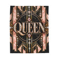 A square decorative throw featuring the word "QUEEN" in large ornate lettering, surrounded by Art Deco-style linework, pink marble-like panels, gold accents, and rhinestone details on a black background.