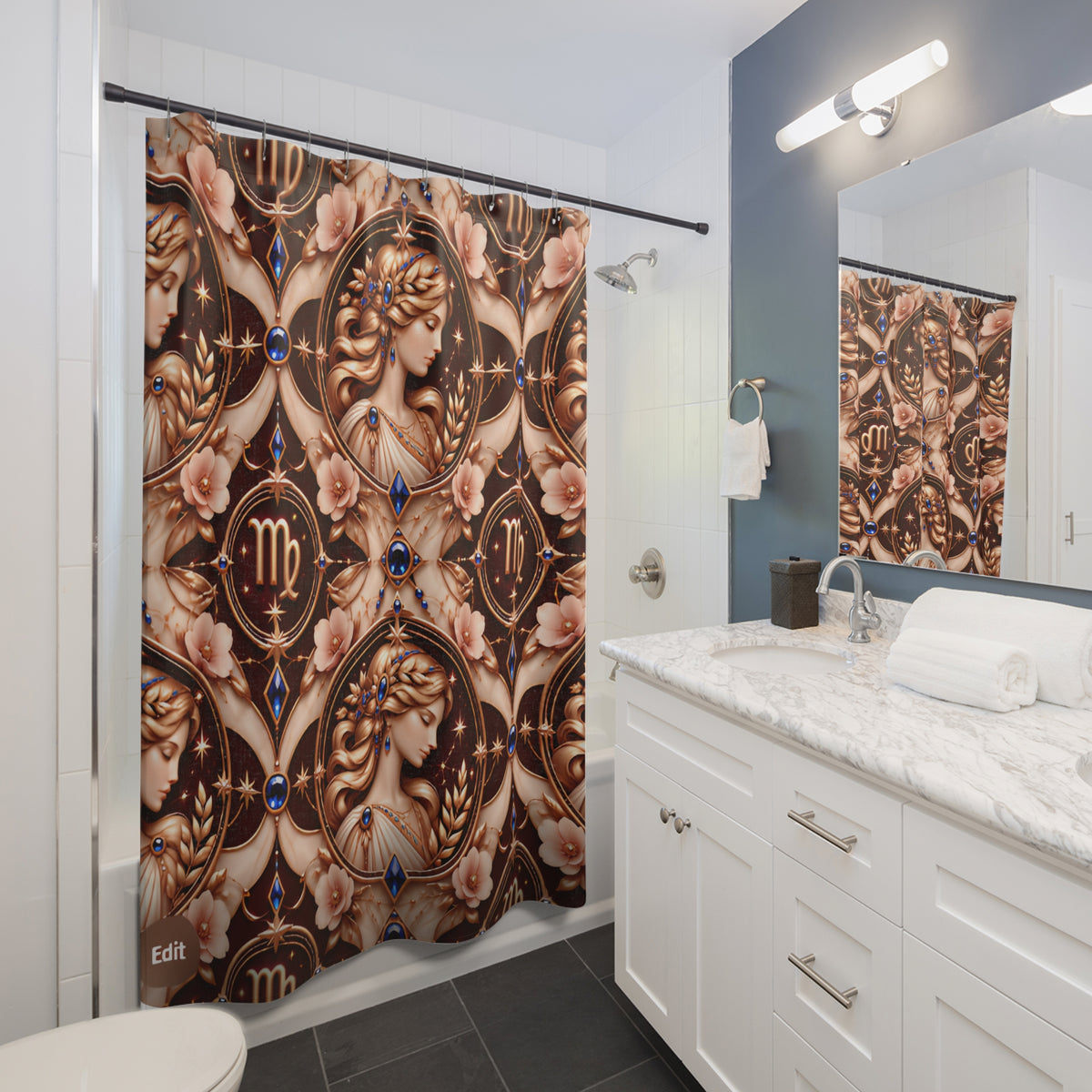 A bathroom shower curtain featuring an ornate classical art design with a woman's profile, floral motifs, and zodiac symbols in brown, beige, and blue tones. The curtain is shown hanging in a modern bathroom with white cabinets, a marble countertop, and a blue accent wall.