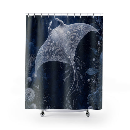 A shower curtain featuring a dark navy blue background with a large white and silver-toned manta ray design, surrounded by delicate botanical and star-like details. The curtain is shown hanging from silver rings on a white rod, with small silver feet visible at the bottom against a plain white background.