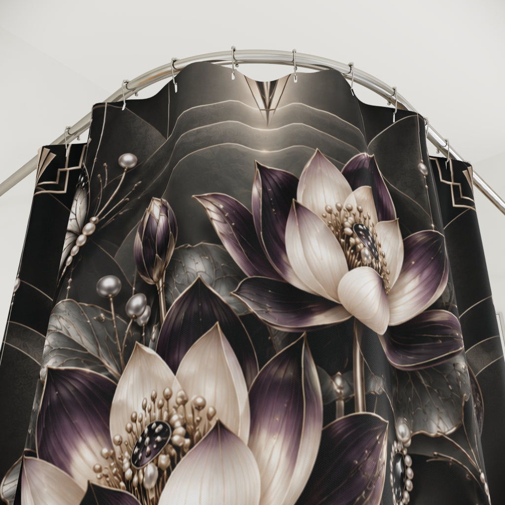 A close-up of a black shower curtain featuring a detailed graphic print of lotus flowers in shades of purple, cream, and metallic gold, hanging from a curved silver metal rod.