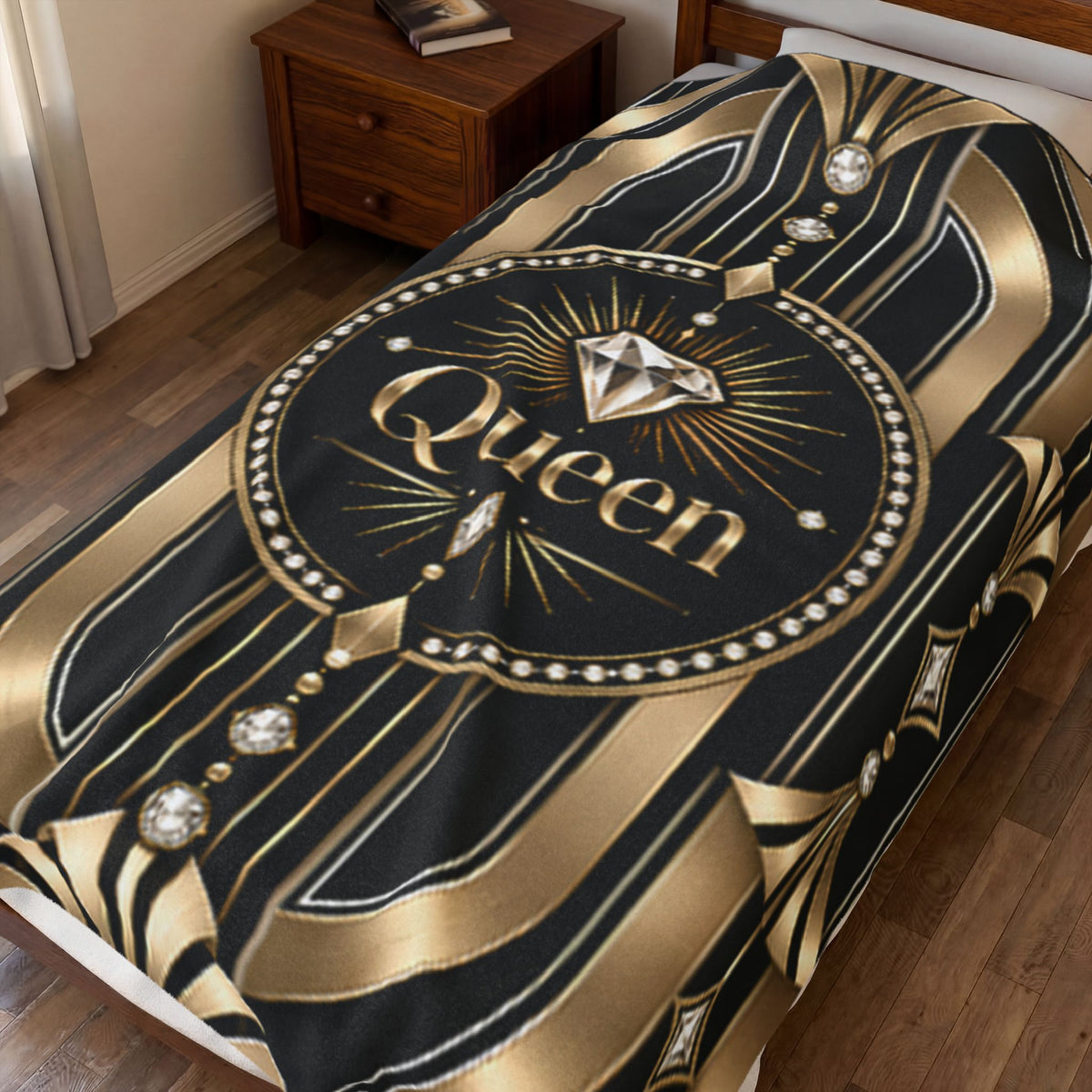 A black and gold bedding set, specifically a duvet cover or comforter, displayed on a bed in a bedroom setting. The design features a prominent circular emblem with the word 'Queen' in gold script, a large diamond graphic, and an Art Deco style pattern with gold stripes and faux gemstone details.