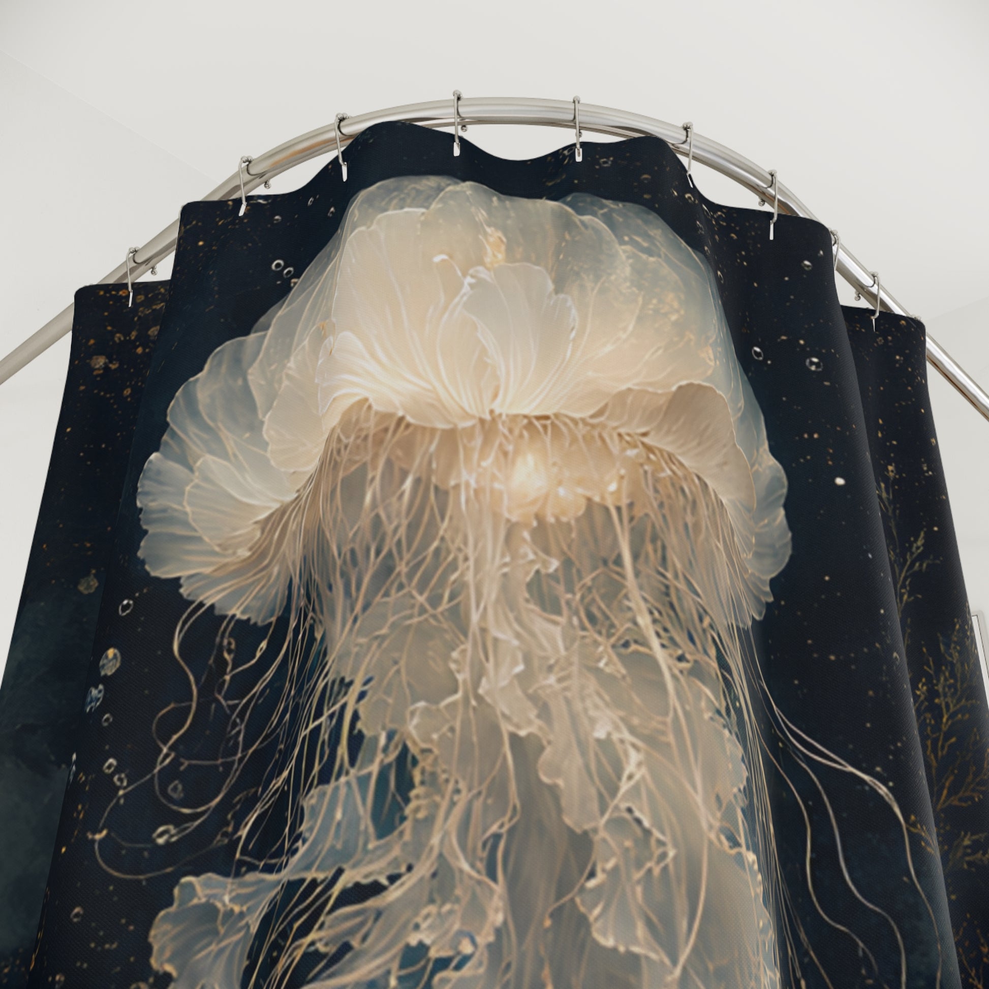A large, realistic jellyfish sculpture or wall art hanging in front of dark navy curtains with a starry pattern, suspended from a curved metal rod against a light background.