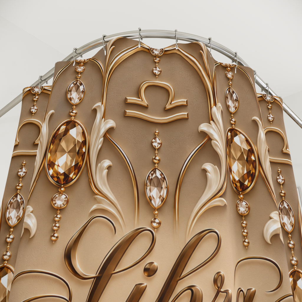 Close-up of an ornate decorative shower curtain with gold and beige scrollwork, faceted crystal-like drops, and a zodiac symbol near the top, photographed against a light neutral background.
