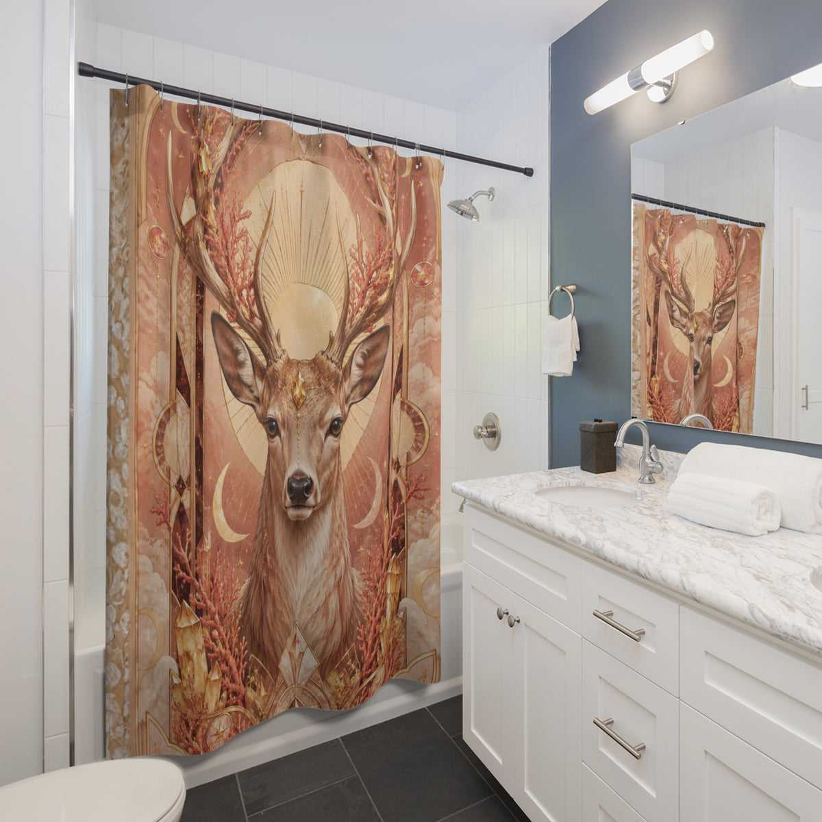 A large deer-themed shower curtain hanging in a modern bathroom. The curtain features a detailed illustration of a stag with antlers in warm earthy tones of brown, beige, and rust orange, surrounded by botanical and celestial motifs.