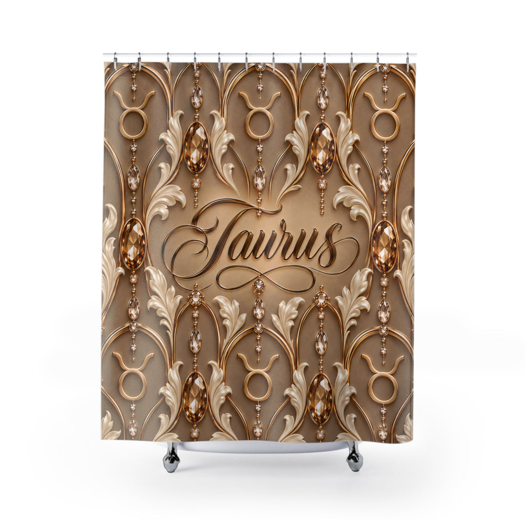 A shower curtain featuring an ornate gold and beige damask-style pattern with hanging bead strands and the word 'Taurus' in script at the center, shown on a white background with small silver hooks and feet visible.