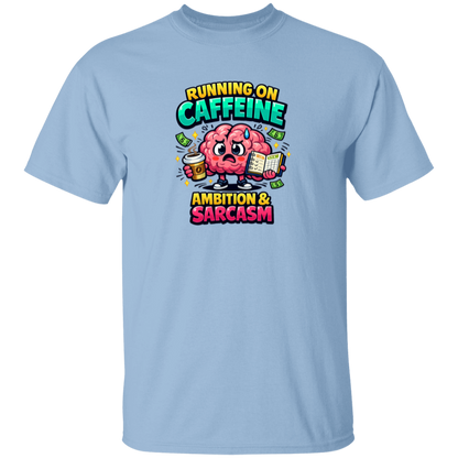 Light blue t-shirt with a colorful graphic of a brain holding a coffee cup and books, with text 'Running on caffeine, ambition & sarcasm' on a white background.