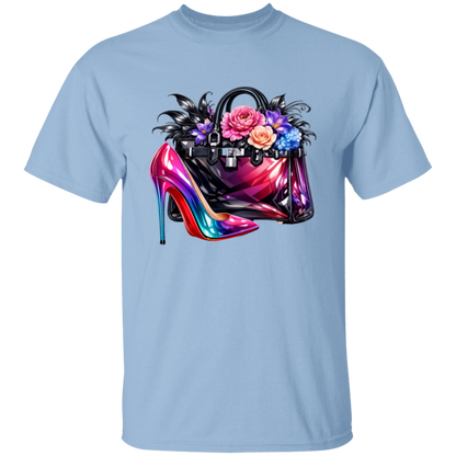 Light blue t-shirt with a colorful high heel shoe and handbag design on a white background