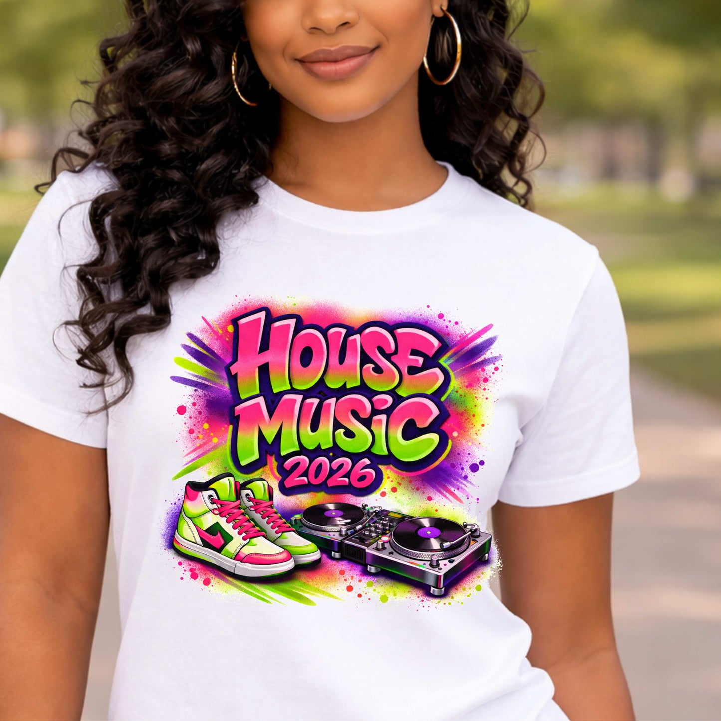 Person wearing a white t-shirt with 'House Music 2026' design featuring colorful text and DJ equipment.