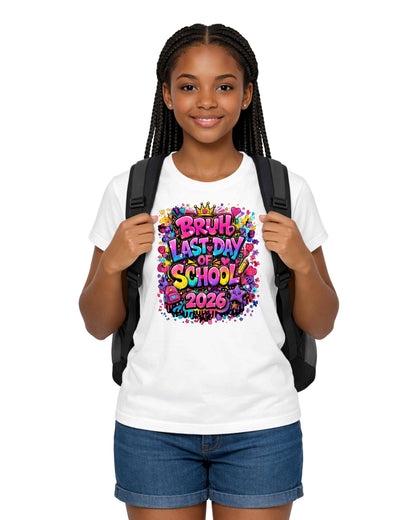 Young girl wearing a white t-shirt with 'Last Day of School 2023' design, holding a black backpack on a white background.