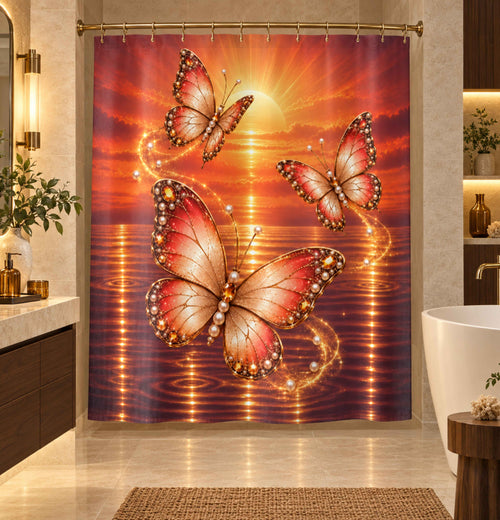 A shower curtain hanging in a bathroom, featuring a vivid sunset scene with three large pink and orange butterflies over reflective water and a glowing sun.